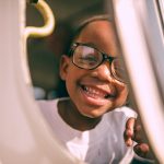 boy taking picture on window